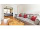 Living room with comfortable seating and view into bedroom with ceiling fan and natural light at 1125 Briarcliff Ne Pl # 14, Atlanta, GA 30306