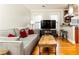Cozy living room with comfortable gray sofa and open to modern kitchen at 1125 Briarcliff Ne Pl # 14, Atlanta, GA 30306