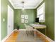 Office with hardwood floors, green accent wall, computer desk, and natural light at 1125 Briarcliff Ne Pl # 14, Atlanta, GA 30306