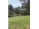 Serene backyard with a view of a pond surrounded by trees, offering a peaceful escape at 1935 Flat Shoals Se Rd, Conyers, GA 30013