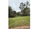 Beautiful backyard with lush greenery and a tranquil pond view, perfect for relaxation at 1935 Flat Shoals Se Rd, Conyers, GA 30013