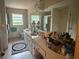 Bright bathroom with a double sink vanity, a large mirror, and lots of natural light at 1935 Flat Shoals Se Rd, Conyers, GA 30013