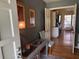 Inviting entryway showcasing hardwood floors, decorative artwork, and a view into the well-lit kitchen at 1935 Flat Shoals Se Rd, Conyers, GA 30013