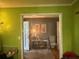 Bright entryway with views to the hall, featuring hardwood floors, decorative artwork, and neutral colors at 1935 Flat Shoals Se Rd, Conyers, GA 30013