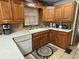 Cozy kitchen features granite counters, oak cabinets, and stainless appliances at 1935 Flat Shoals Se Rd, Conyers, GA 30013