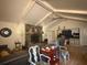 Inviting living room with vaulted ceilings, stone fireplace, and neutral color palette at 1935 Flat Shoals Se Rd, Conyers, GA 30013