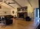 Spacious living room featuring a stone fireplace, vaulted ceilings, and hardwood floors at 1935 Flat Shoals Se Rd, Conyers, GA 30013