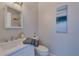 Cozy bathroom features sleek fixtures, white sink and toilet, and an elegant marble shower at 20 Marietta Nw St # 15D, Atlanta, GA 30303