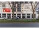 View of The Metropolitan building with street, cars, and advertising banner at 20 Marietta Nw St # 15D, Atlanta, GA 30303