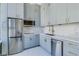 Modern kitchen with stainless steel appliances, sleek cabinets, and quartz countertops at 20 Marietta Nw St # 15D, Atlanta, GA 30303