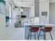 Bright kitchen features stainless steel appliances, breakfast bar, and modern gray cabinetry at 20 Marietta Nw St # 15D, Atlanta, GA 30303
