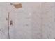 Modern shower features marble-style tiling, a rainfall showerhead, and handheld sprayer at 20 Marietta Nw St # 15D, Atlanta, GA 30303