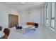 This bright sitting area features a stylish marble table set, cabinet, and natural light at 20 Marietta Nw St # 15D, Atlanta, GA 30303
