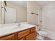 Bright bathroom featuring a single sink vanity, a mirror, and a shower-tub combination at 2229 Polder Way, Austell, GA 30168