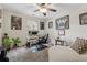 Bedroom with a ceiling fan, computer desk, and decorative sports memorabilia at 2229 Polder Way, Austell, GA 30168