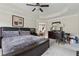 Main bedroom featuring tray ceiling, decorative art, and an ensuite bathroom at 2229 Polder Way, Austell, GA 30168