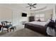 View of main bedroom showing tray ceiling, tv, dark furniture, and attached bath at 2229 Polder Way, Austell, GA 30168