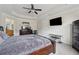 Spacious main bedroom featuring tray ceiling, ensuite, and dark wood furniture at 2229 Polder Way, Austell, GA 30168