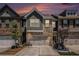 Charming townhome featuring a two-car garage and a beautifully landscaped front yard at 2404 Fitts Dr, Conyers, GA 30094