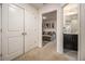 Hallway leading to a living area and bathroom, showcasing the home's layout at 2404 Fitts Dr, Conyers, GA 30094