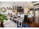 Open-concept kitchen and dining area with modern decor and hardwood floors at 2404 Fitts Dr, Conyers, GA 30094