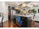 Modern kitchen with island, stainless appliances, and view to living room and staircase at 2404 Fitts Dr, Conyers, GA 30094