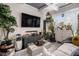 Bright living room with a large TV, unique decor, and hardwood floors at 2404 Fitts Dr, Conyers, GA 30094