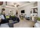 Bright main bedroom with a comfortable bed, fireplace, and adjoining bathroom at 2404 Fitts Dr, Conyers, GA 30094
