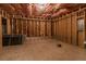 Unfinished basement showcasing the framing, insulation and rough flooring offering a blank canvas for your project at 925 Hill Se St, Atlanta, GA 30315
