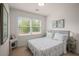 Bedroom with natural light from a window, complemented by calming decor and two side tables at 925 Hill Se St, Atlanta, GA 30315