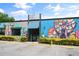 The building's exterior is enhanced with colorful murals and vibrant storefront art, adding a unique, lively touch to the streetscape at 925 Hill Se St, Atlanta, GA 30315