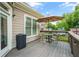 Outdoor deck featuring table, chairs, umbrella and grill, perfect for relaxing and entertaining guests at 925 Hill Se St, Atlanta, GA 30315