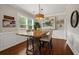 Bright dining room with hardwood floors, industrial style lighting, and large windows at 925 Hill Se St, Atlanta, GA 30315