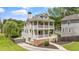 Side view of a two-story house with a double porch, showcasing its well-maintained lawn at 925 Hill Se St, Atlanta, GA 30315