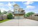 Exterior featuring a two car garage, basketball hoop, and upper and lower balconies at 925 Hill Se St, Atlanta, GA 30315