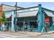 Charming bakery storefront featuring colorful awnings, seating, and artistic details creating an inviting neighborhood destination at 925 Hill Se St, Atlanta, GA 30315