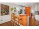 Modern kitchen with breakfast bar, stainless steel appliances, and hardwood floors at 925 Hill Se St, Atlanta, GA 30315