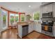Bright kitchen with modern appliances, granite countertops, and views of the backyard at 925 Hill Se St, Atlanta, GA 30315