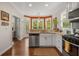 Well-lit kitchen with stainless steel appliances, granite countertops, and hardwood floors at 925 Hill Se St, Atlanta, GA 30315