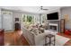 Open-concept living room with fireplace, large windows, and hardwood floors at 925 Hill Se St, Atlanta, GA 30315
