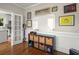 The home office has storage shelves with baskets, hardwood floors, and white base molding at 925 Hill Se St, Atlanta, GA 30315