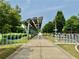 Scenic view of the park's paved pathway with solar panels for shaded seating and recreation at 925 Hill Se St, Atlanta, GA 30315