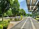 Well-maintained park pathway featuring shaded seating areas and modern playground equipment at 925 Hill Se St, Atlanta, GA 30315