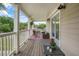 Inviting porch with seating area, rug and table providing a welcoming outdoor living space at 925 Hill Se St, Atlanta, GA 30315