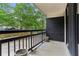 Private balcony with views of lush greenery at 1130 Piedmont Ne Ave # 410, Atlanta, GA 30309