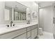 Bright bathroom with double sink vanity, modern fixtures, quartz counters, and walk-in glass shower at 1130 Piedmont Ne Ave # 410, Atlanta, GA 30309