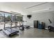 Well-equipped gym with treadmills, elliptical machines, and large windows offering natural light and views at 1130 Piedmont Ne Ave # 410, Atlanta, GA 30309