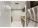 Kitchen with stainless steel refrigerator, wood cabinets and granite countertops at 1130 Piedmont Ne Ave # 410, Atlanta, GA 30309