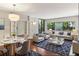 Open living room boasts large windows, hardwood floors, and modern furnishings at 1130 Piedmont Ne Ave # 410, Atlanta, GA 30309