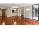 Spacious living area showcasing hardwood floors, open layout, and balcony access at 1130 Piedmont Ne Ave # 410, Atlanta, GA 30309